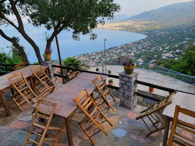 Cozy terrace with outdoor seating and views of the green hills surrounding Viña del Mar.