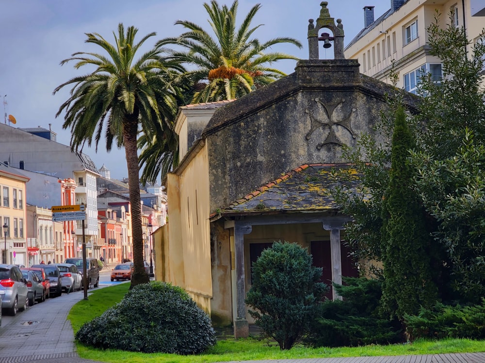 a small building with a clock on the top of it