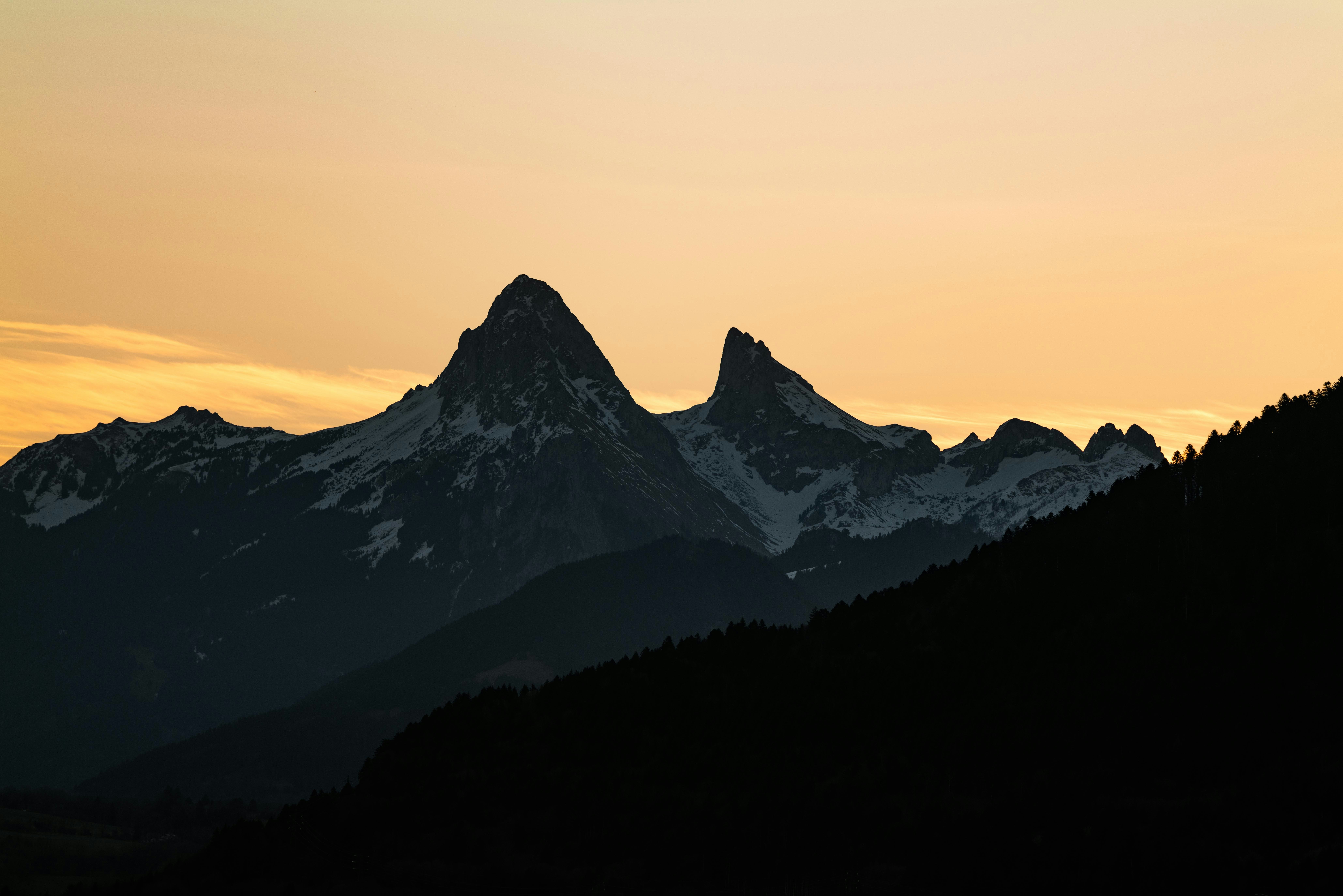 a view of a mountain range at sunset
