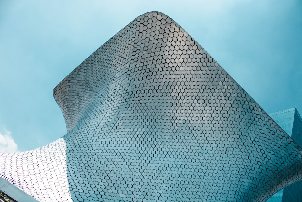 a very tall building with a curved roof