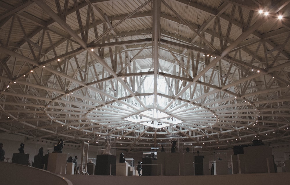 the ceiling of a large building with lights hanging from the ceiling