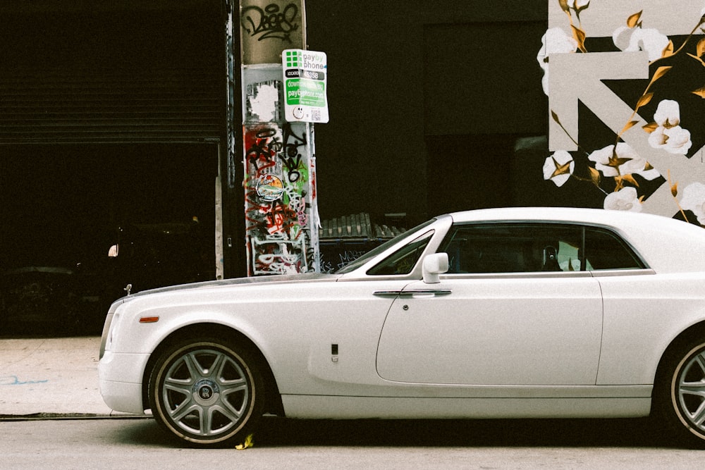 a white car parked on the side of the road