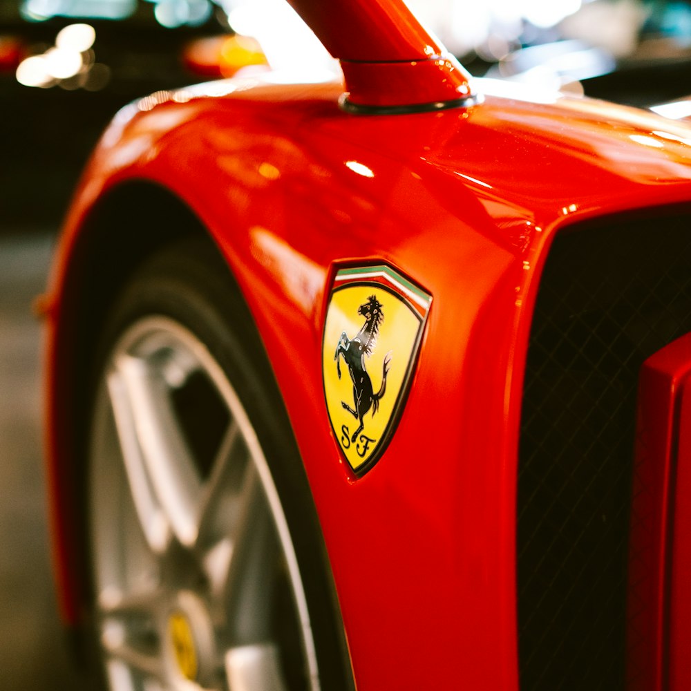 a close up of a red sports car