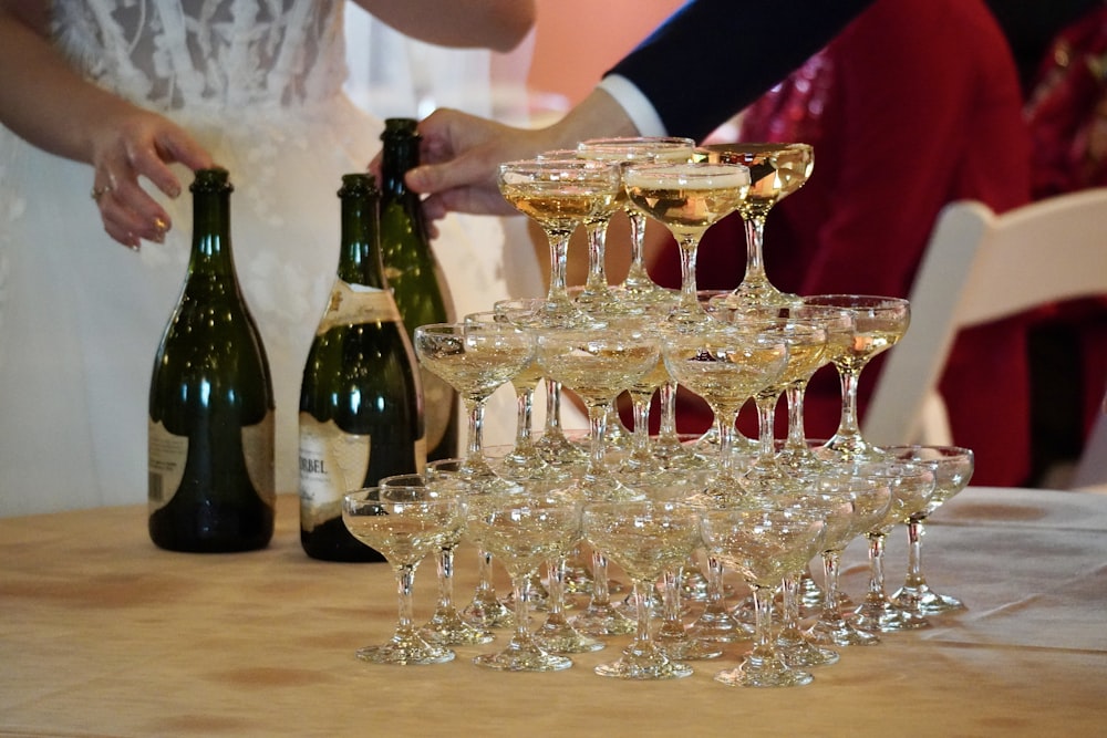 a table topped with lots of wine glasses