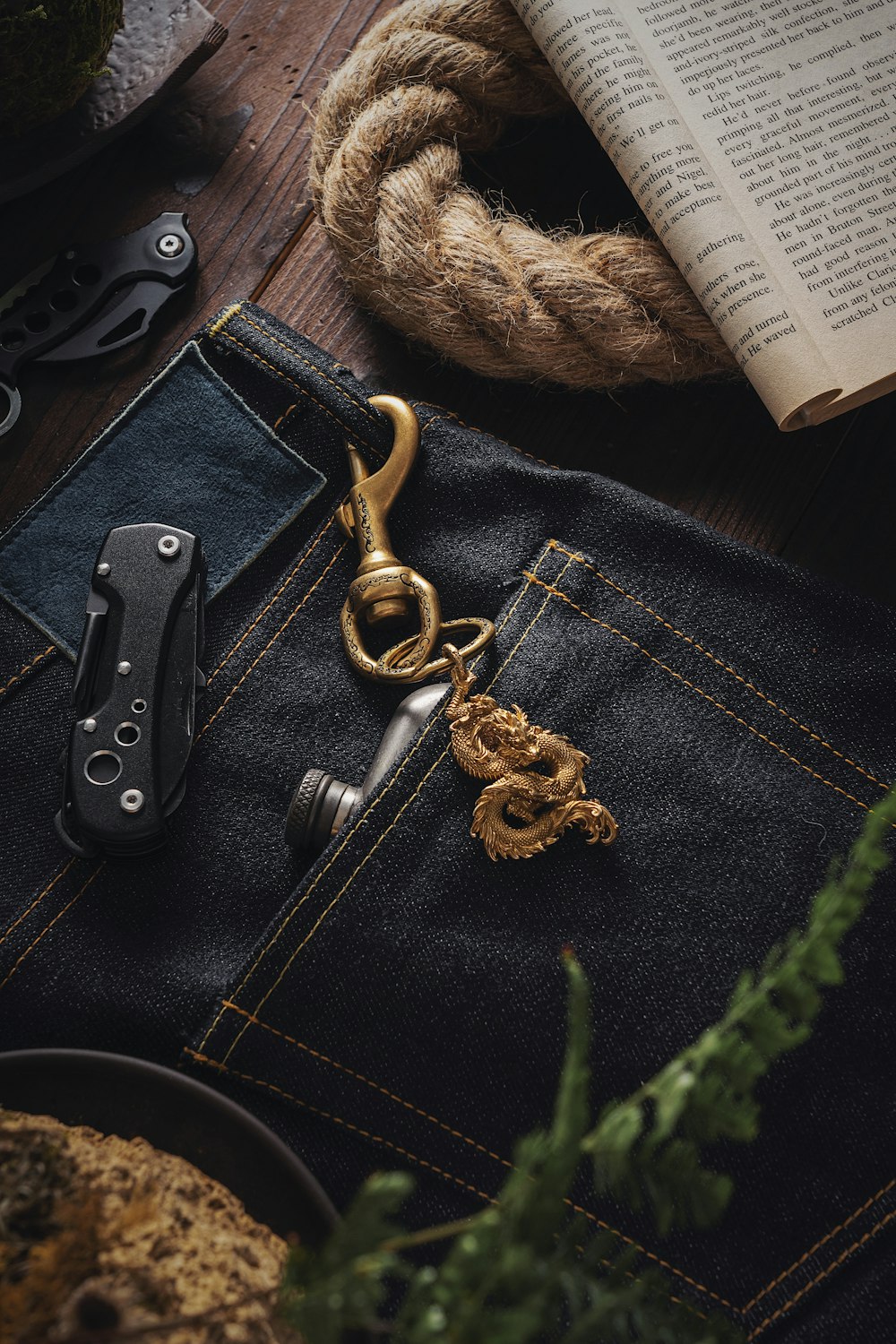 a pair of scissors sitting on a pair of jeans