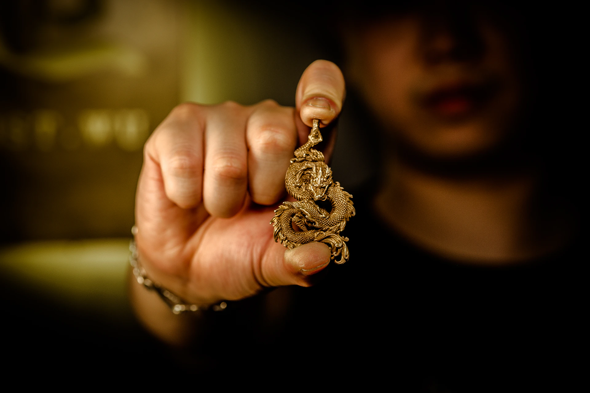 a person holding a snake charm in their hand