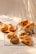An assortment of freshly baked Mexican breads arranged attractively on a wooden board.