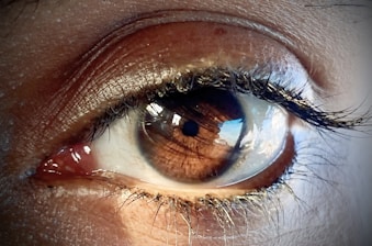 a close up of a person's blue eye