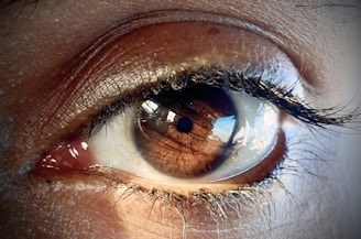 a close up of a person's blue eye