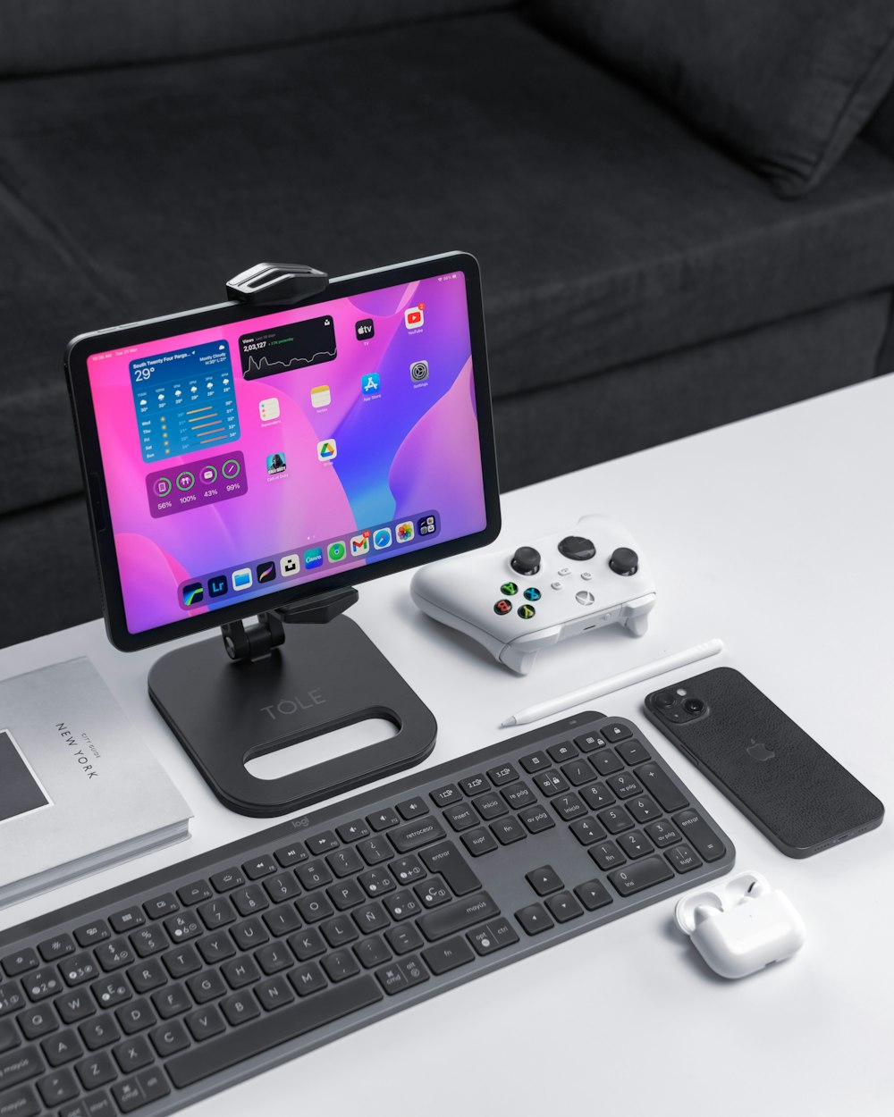 a desk with a keyboard, mouse and monitor