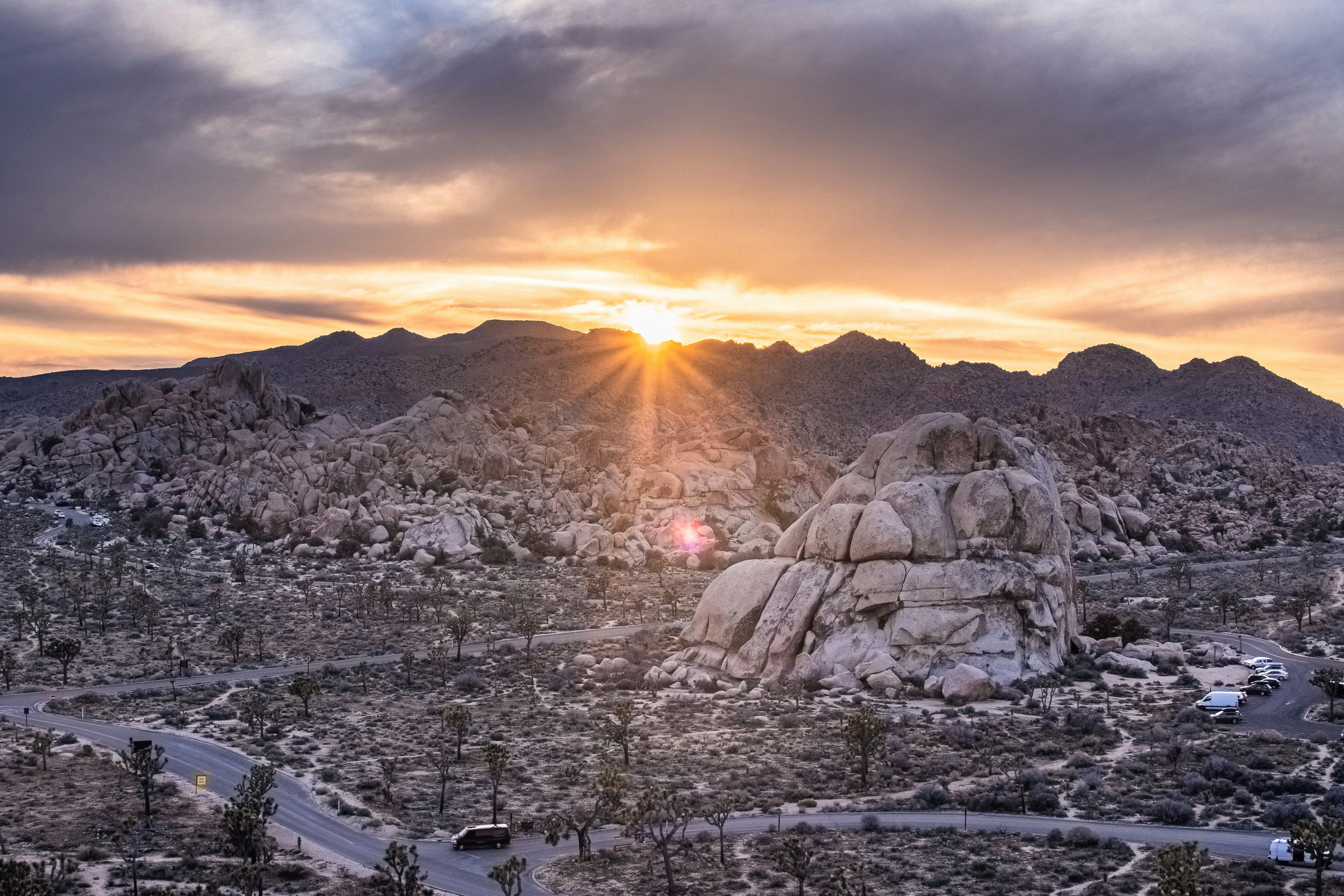 The sun is setting over the mountains in the desert photo – Free ...