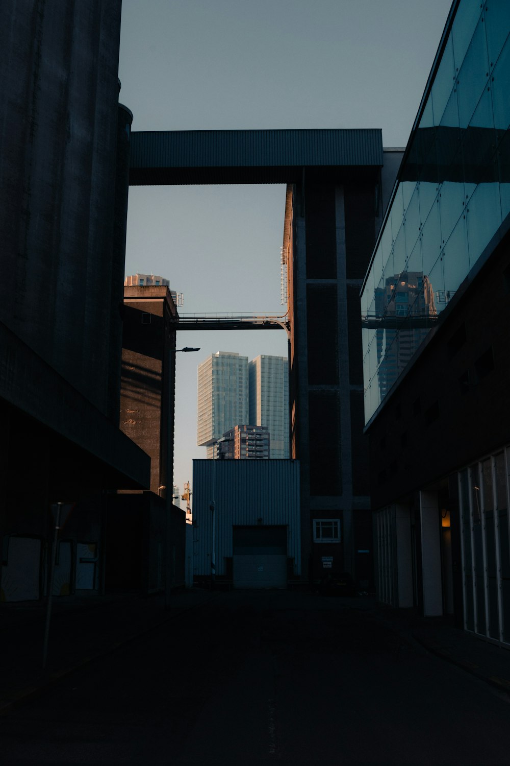 a view of a city from an alley way