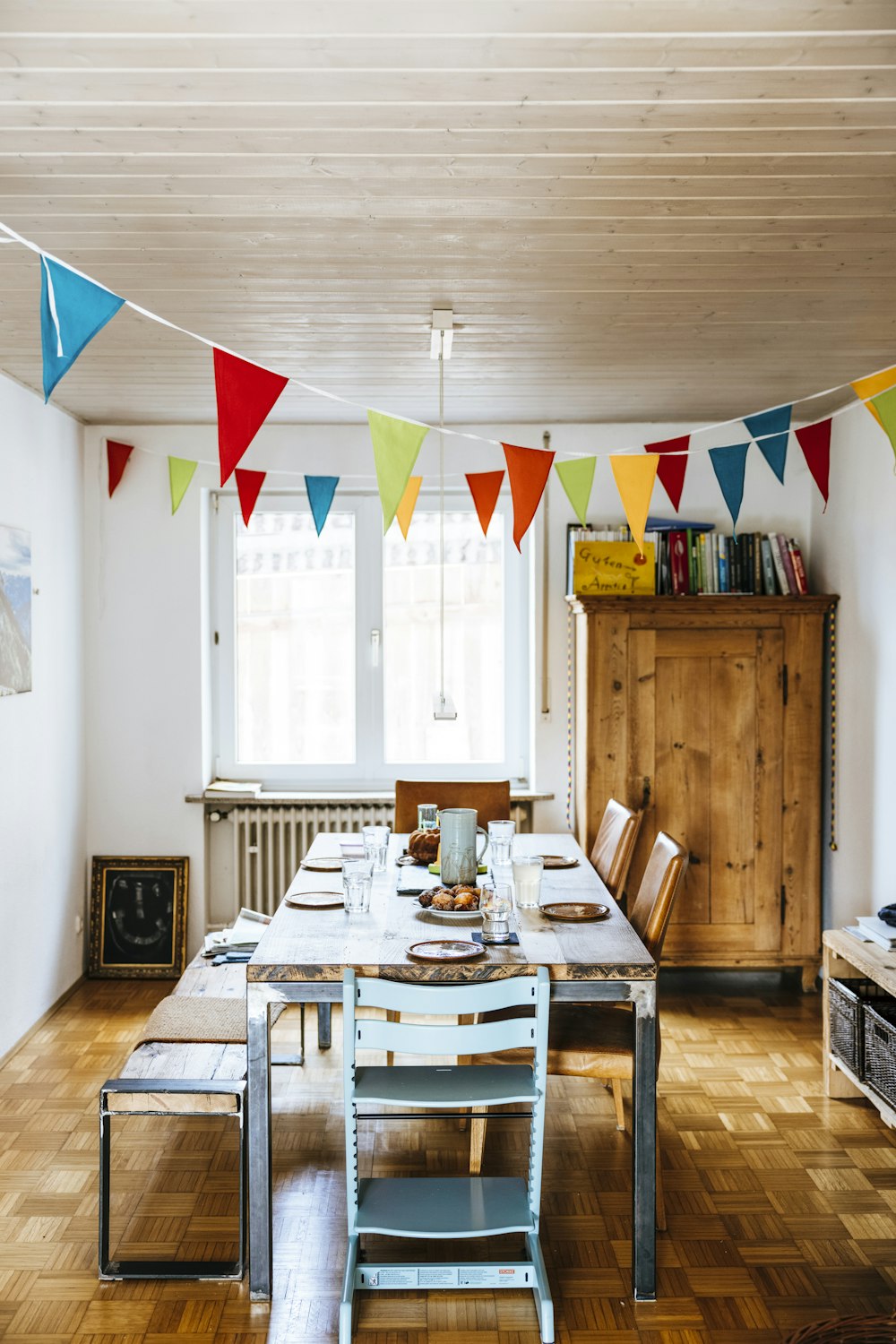 a dining room with a table and chairs