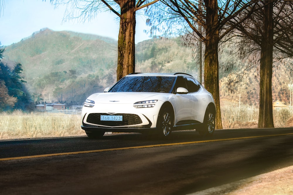 a white car parked on the side of the road