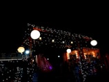 A beautifully set outdoor wedding reception with twinkling lights.