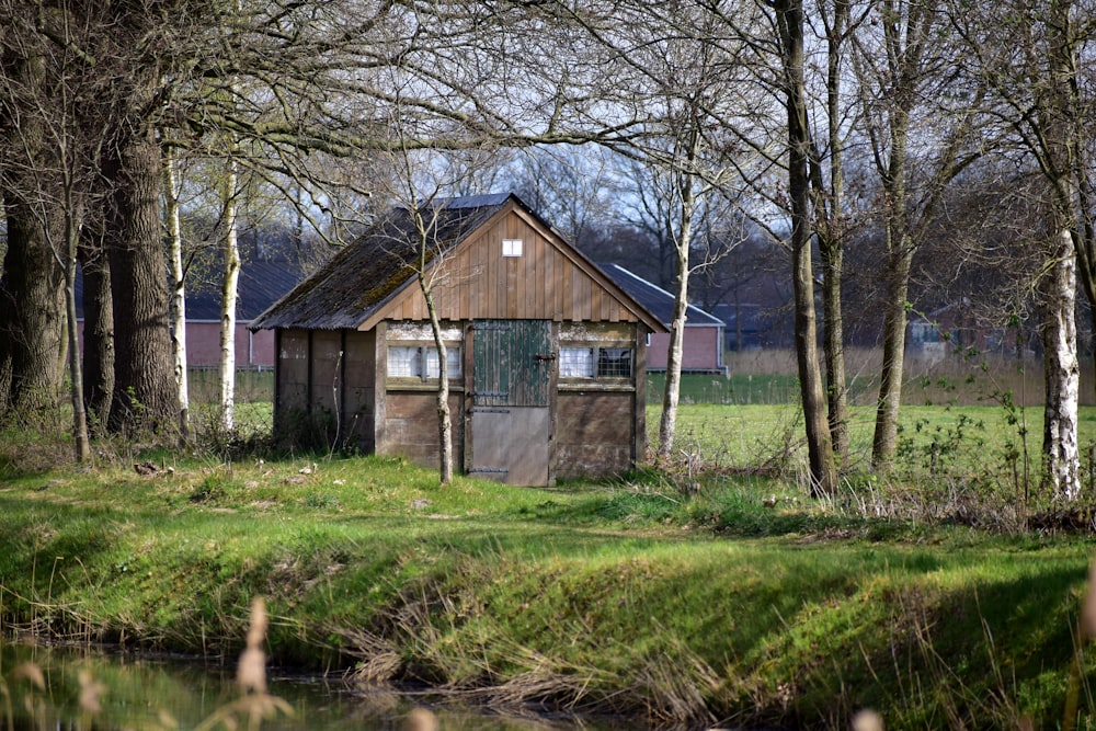 a small building in the middle of a field