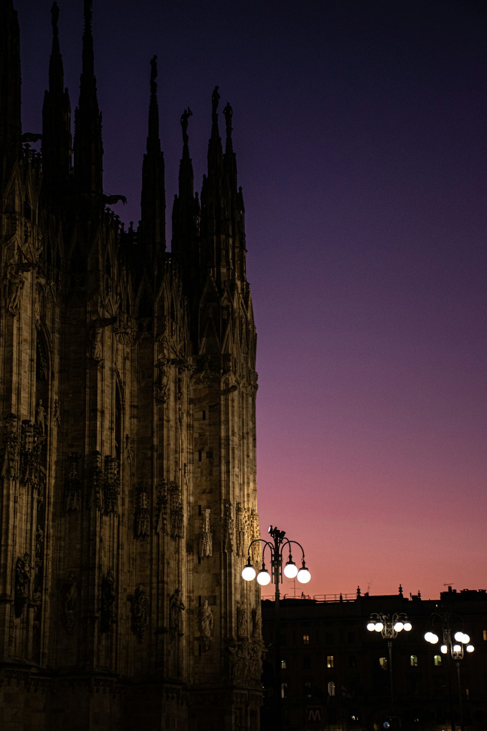 a very tall building with a street light in front of it