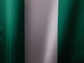 a close up of a green and white curtain