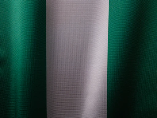 a close up of a green and white curtain