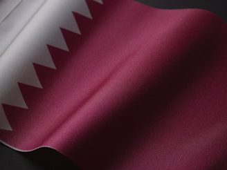 a close up of a pink and white fabric