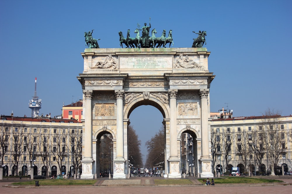 a large arch with statues on top of it