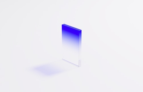 a blue and white square shaped object on a white surface