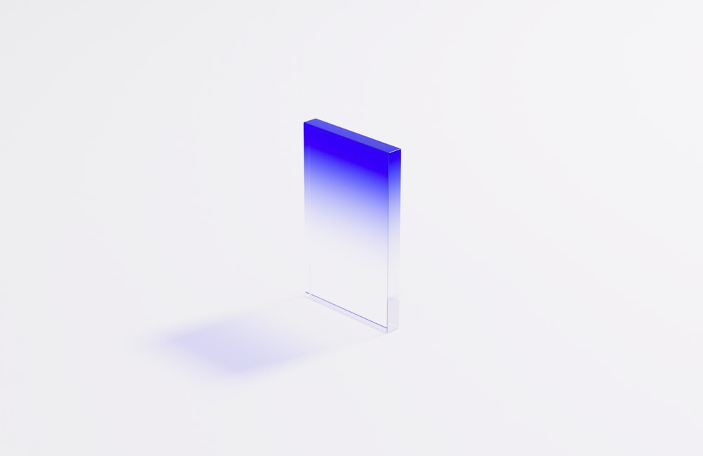 a blue and white square shaped object on a white surface