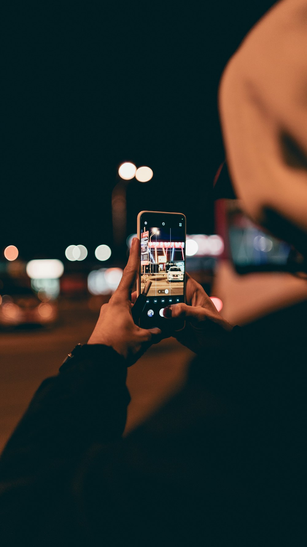 a person taking a picture with a cell phone