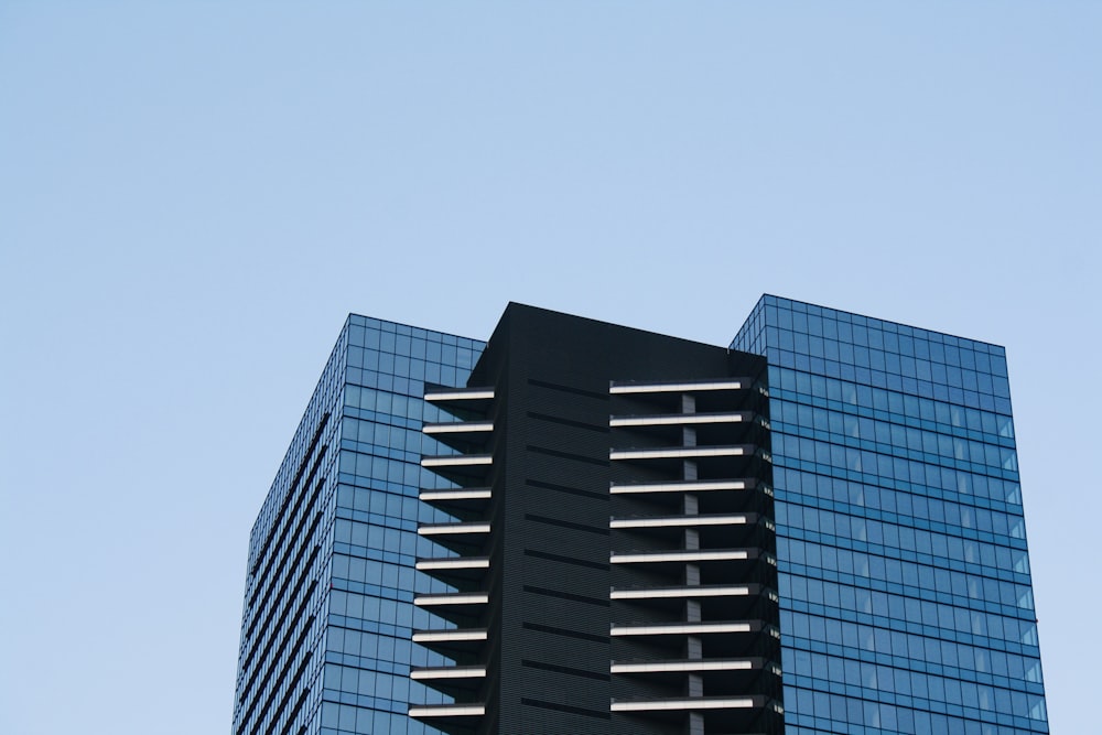 a very tall building with a very tall clock on it's side