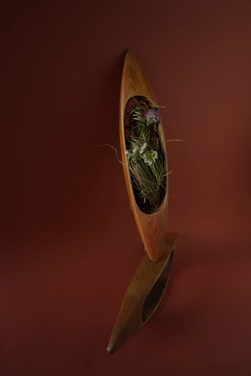 A sturdy wooden plinth with a smooth finish, perfect for showcasing sculptures or plants.