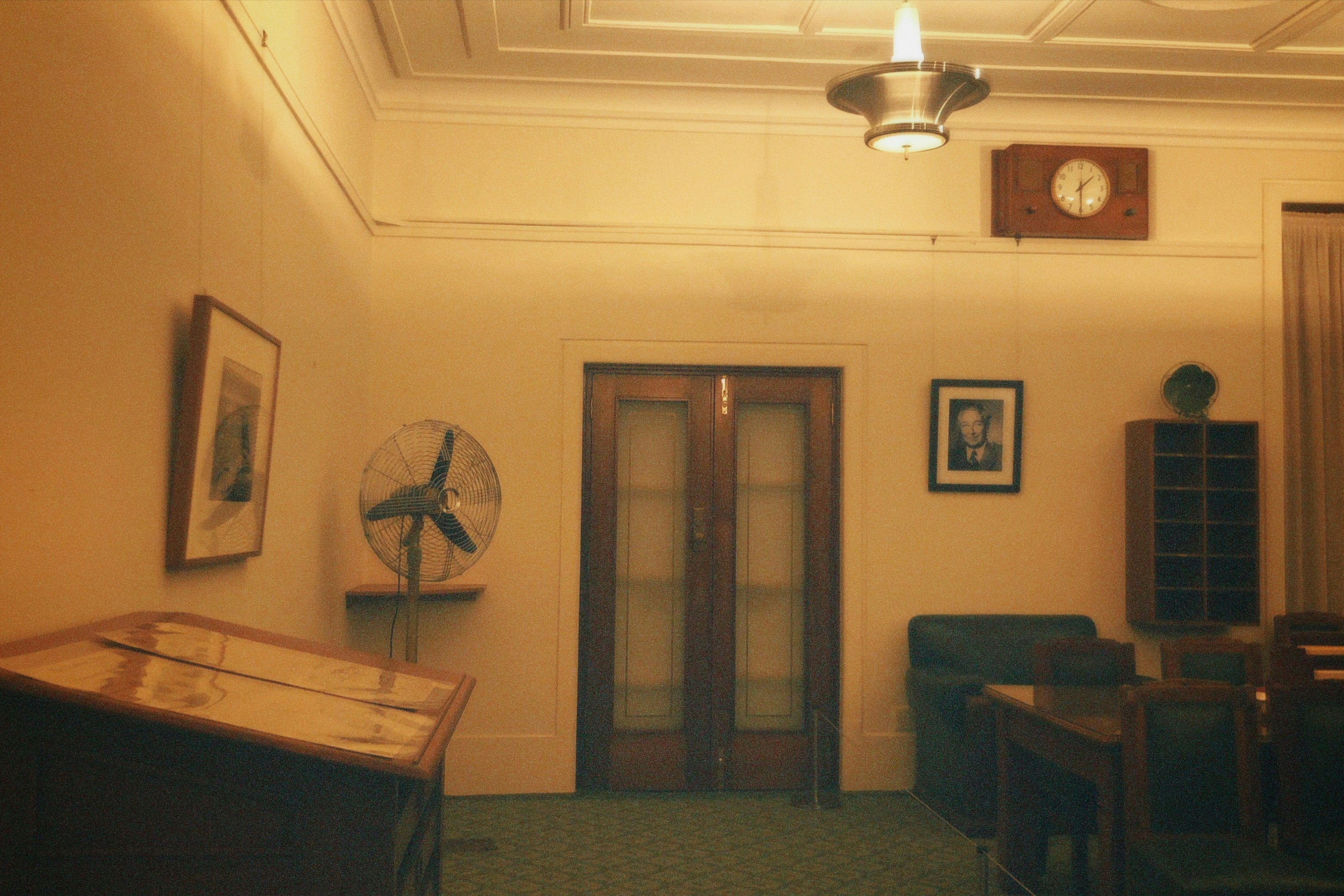 Legal consultation room with clock and furniture