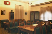 A calm meeting room set up for mediation with chairs arranged in a circle.