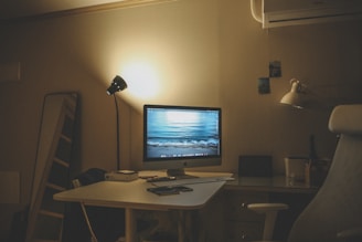 a desktop computer sitting on top of a white desk