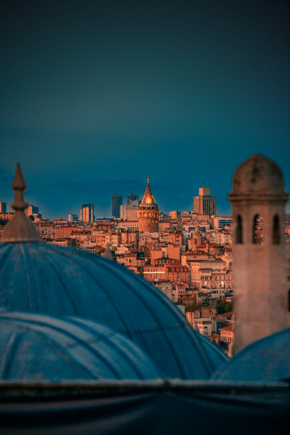 a view of a city at night from a rooftop