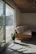 A freshly cleaned, cozy living room with fresh cushions and clear surfaces.