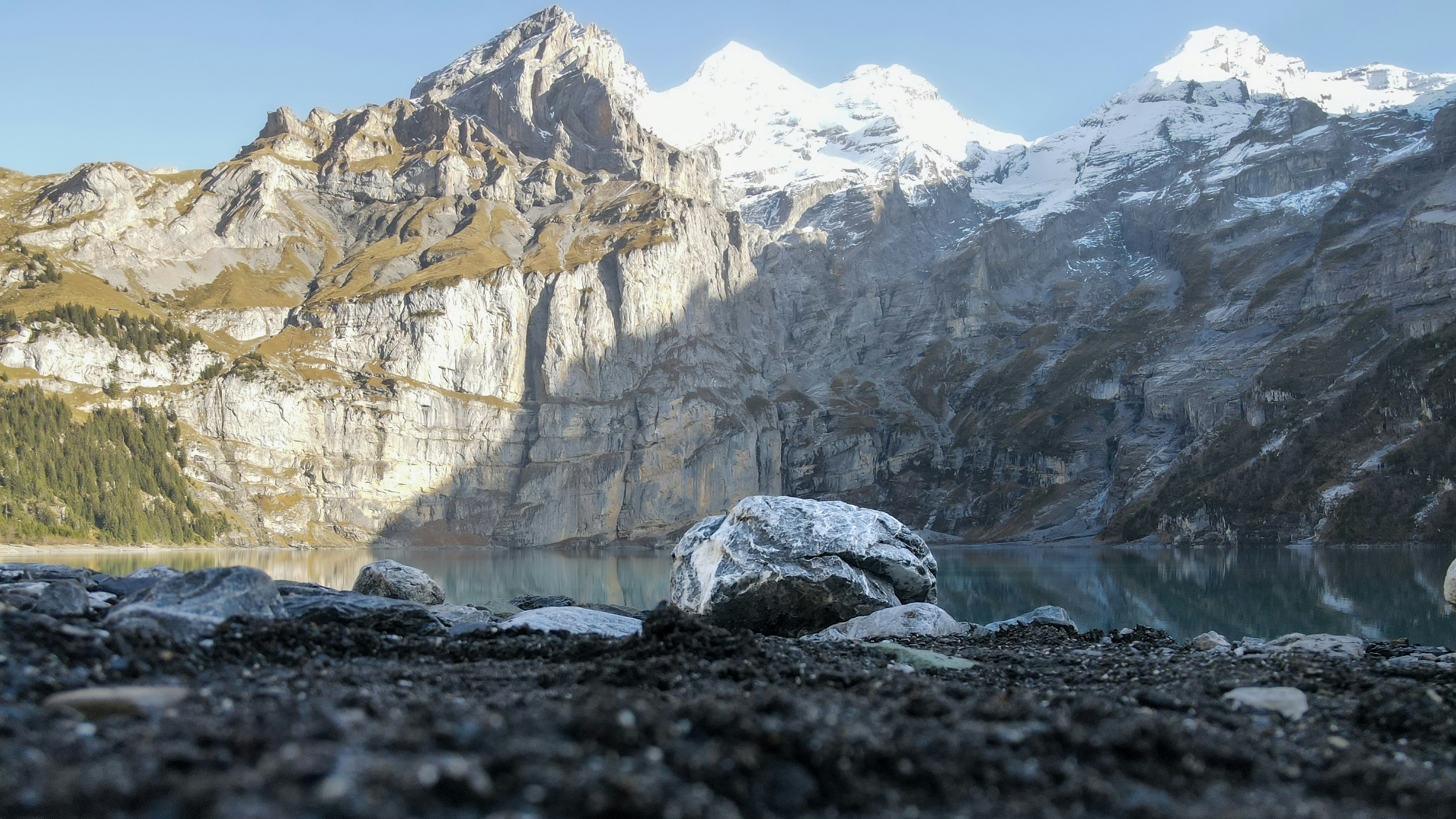 a large rock sitting on top of a rocky hillside
