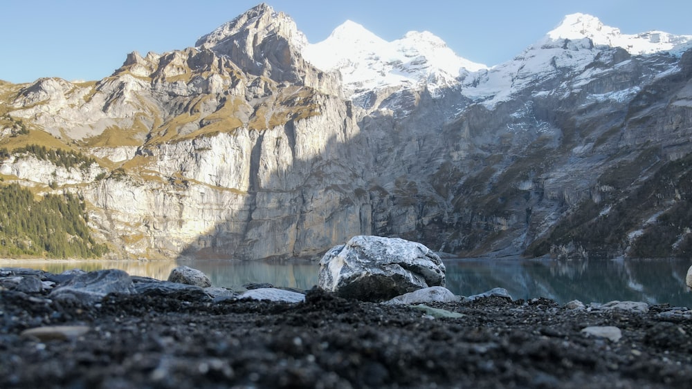 a large rock sitting on top of a rocky hillside