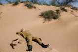Sturdy military helmet resting on desert sand