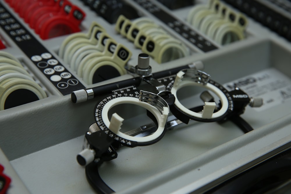 a close up of a machine with a pair of glasses on it