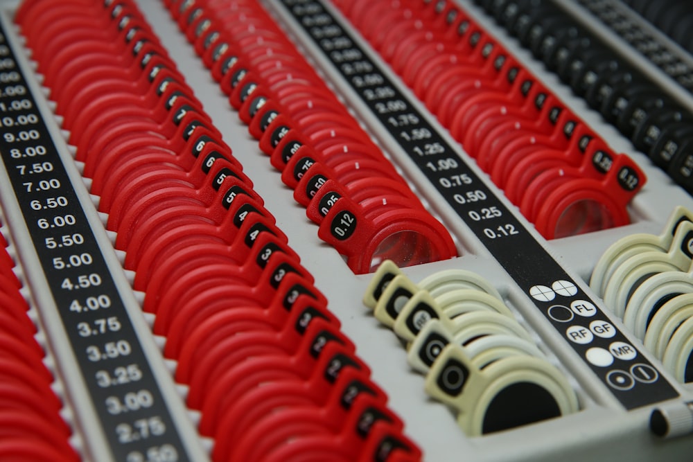 a row of red and white buttons and numbers