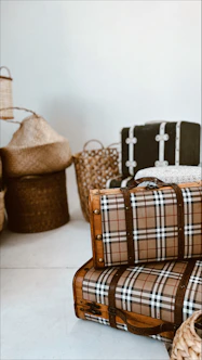 a stack of luggage sitting on top of a white floor
