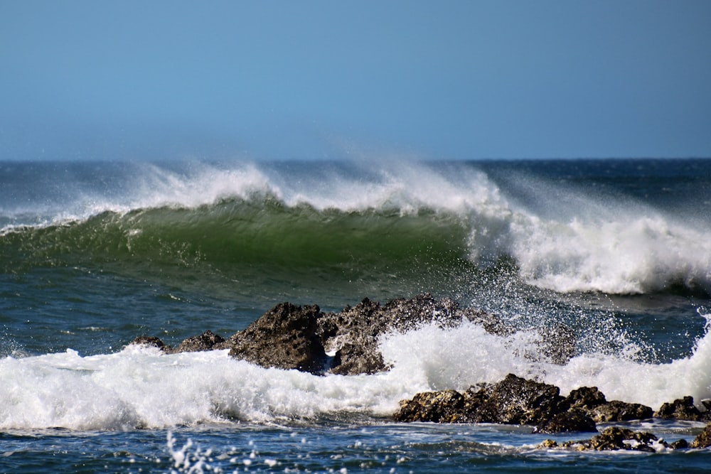 a person riding a surfboard on a wave in the ocean