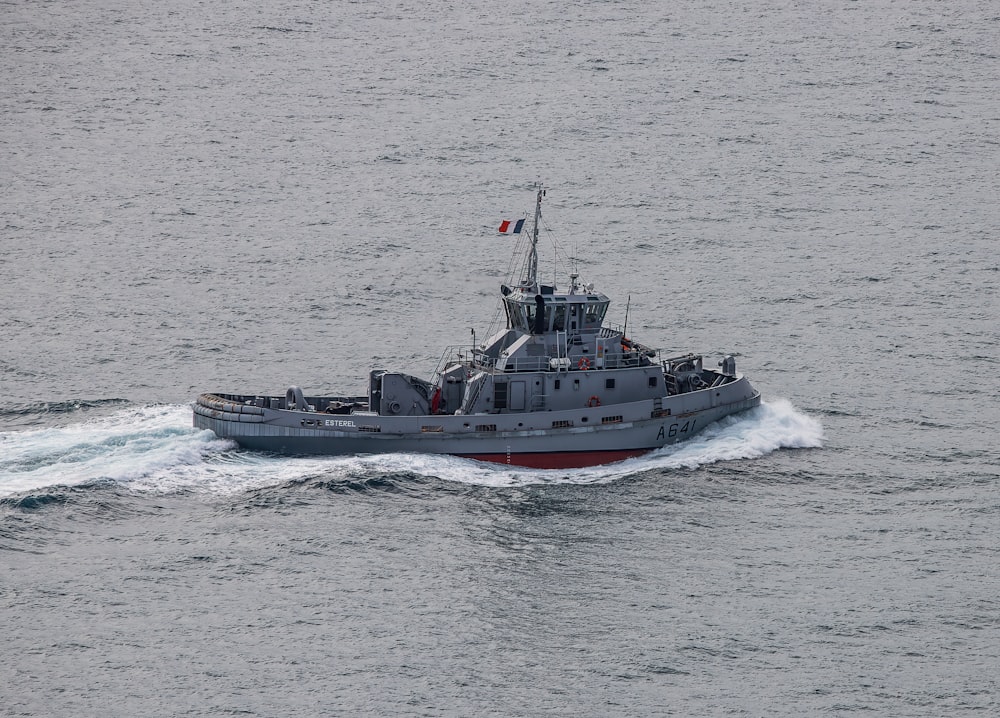 a small boat in the middle of a body of water