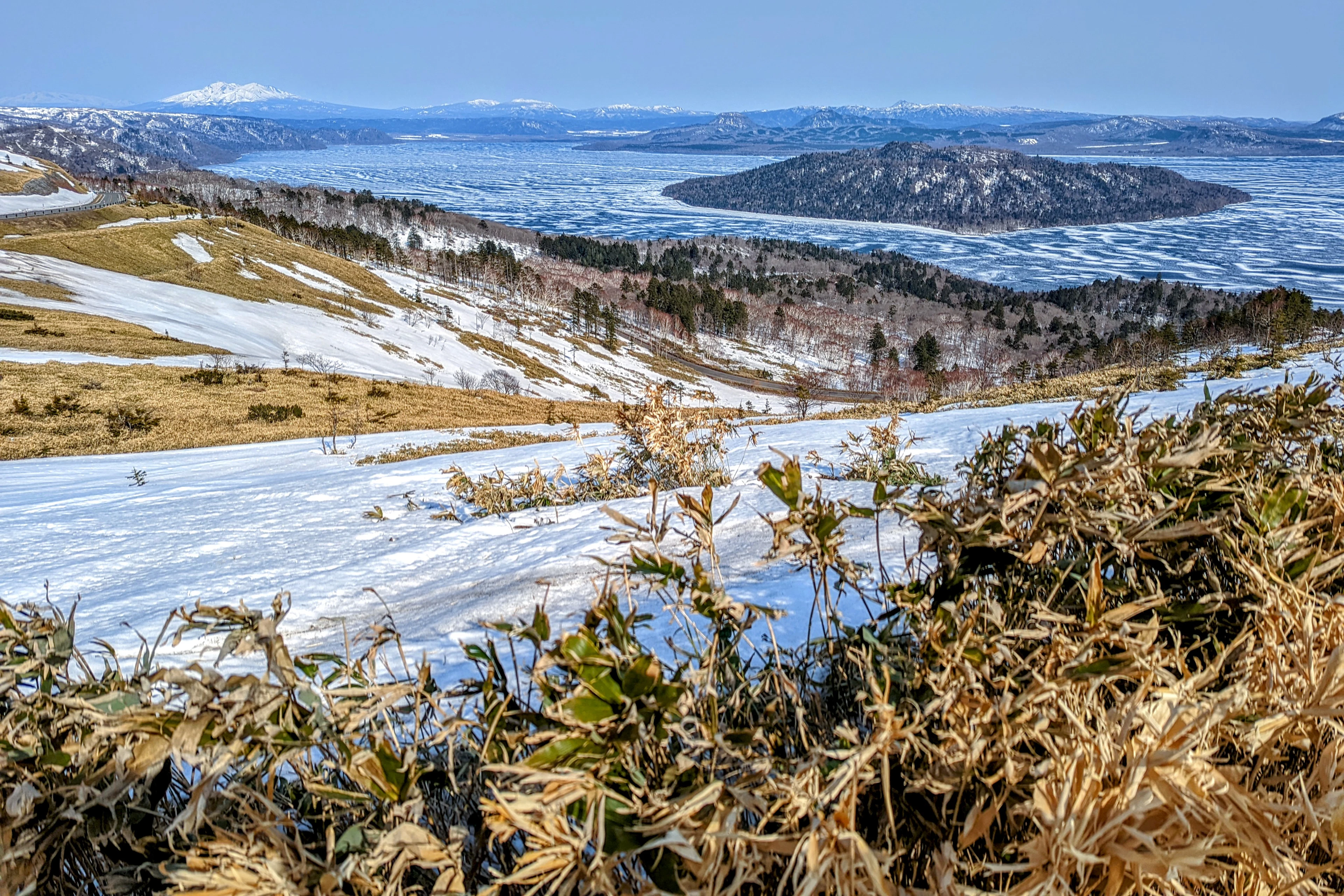 A partly frozen Lake Kussharo seen from the Bihoro Pass