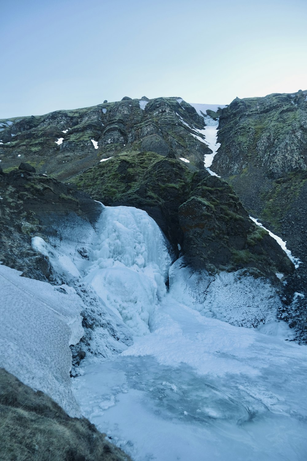 a man standing on top of a snow covered mountain