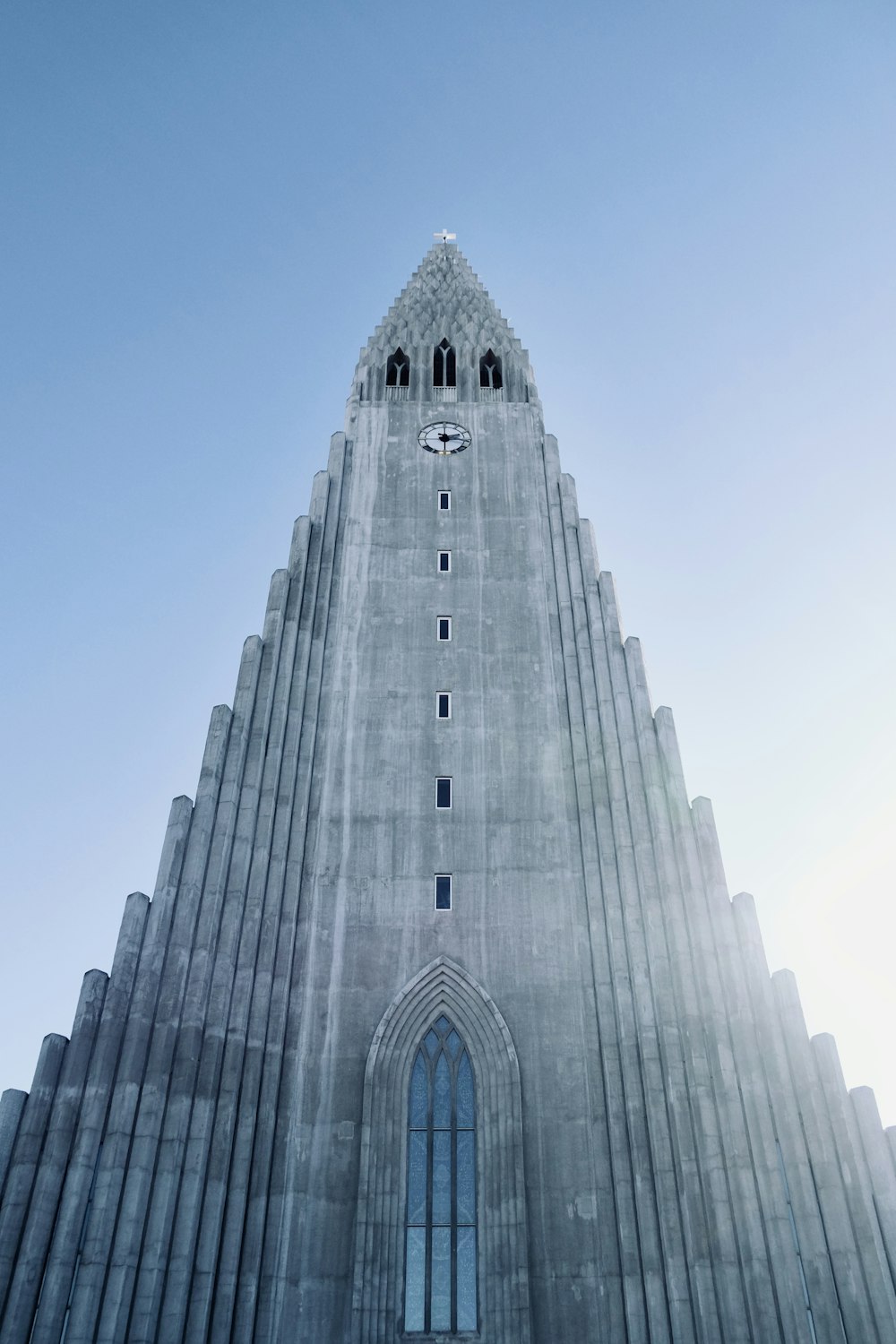 a very tall building with a clock on it's face