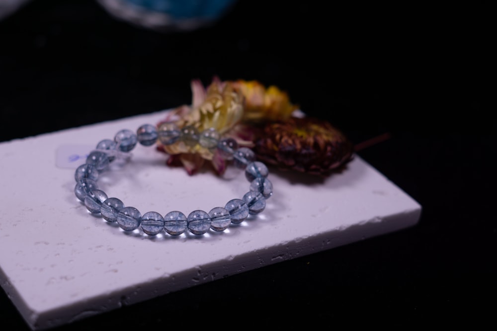 a close up of a bracelet on a table