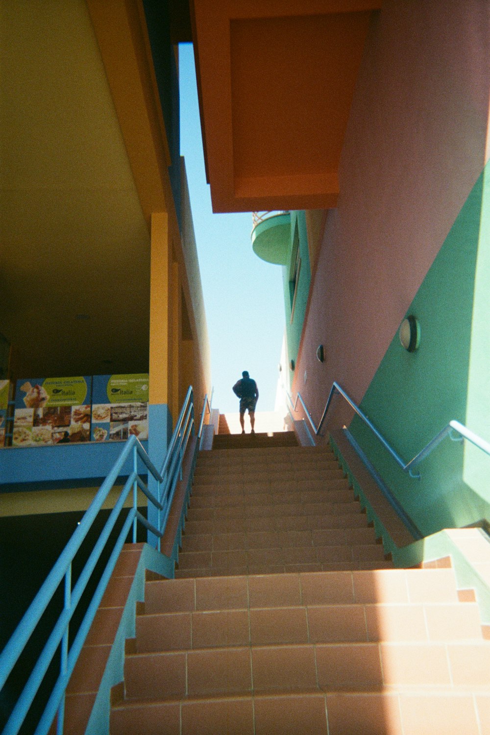 a man walking down a flight of stairs