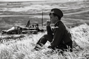 Siddhesh gazing at the horizon in a military-style jacket, embodying his dream.