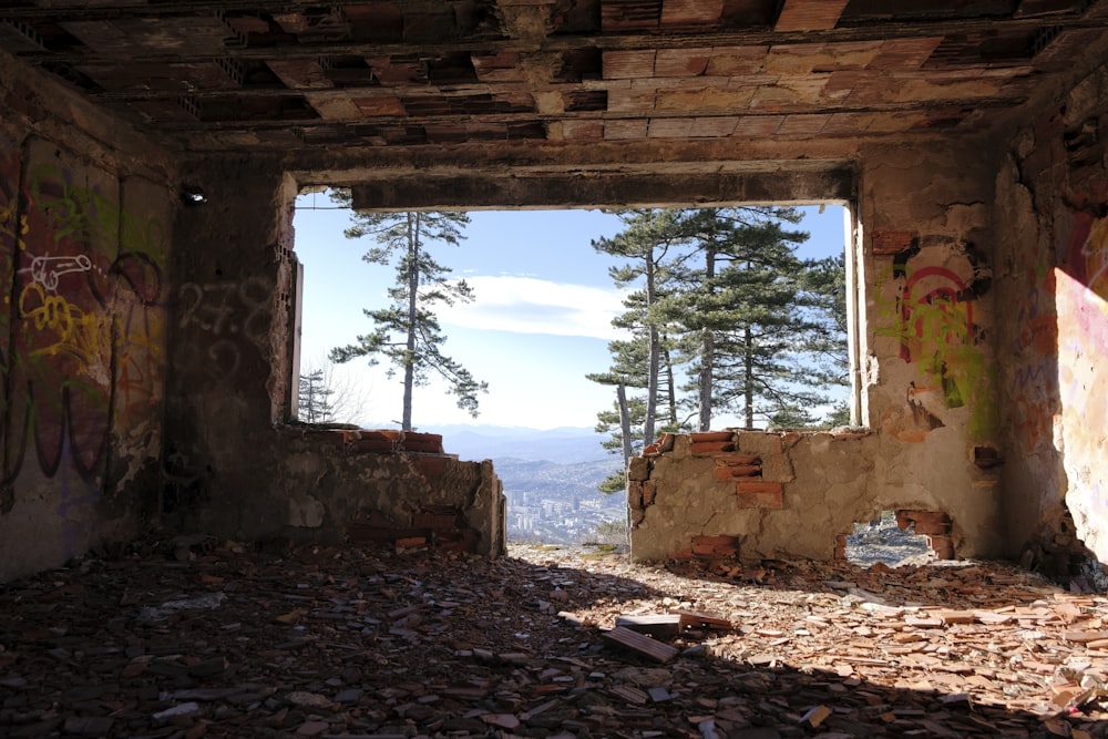 an abandoned building with graffiti on the walls